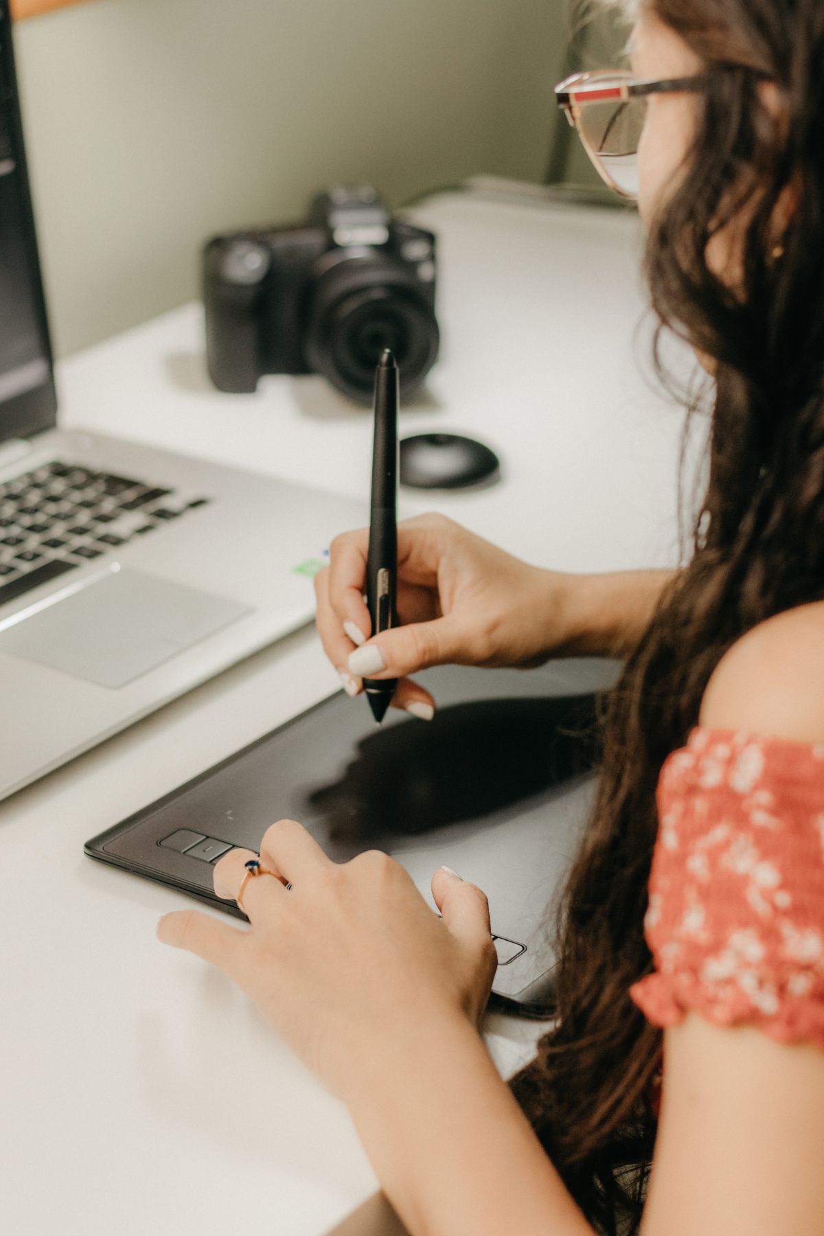 Designer sketching creative assets on a tablet