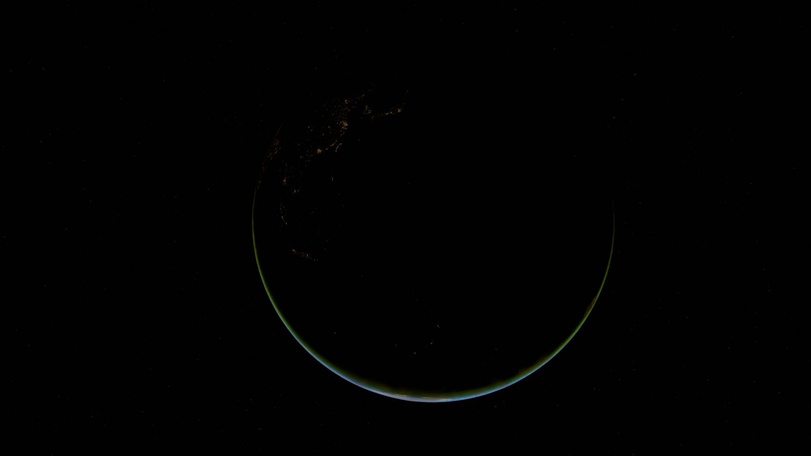 Earth at night showing illuminated cities
