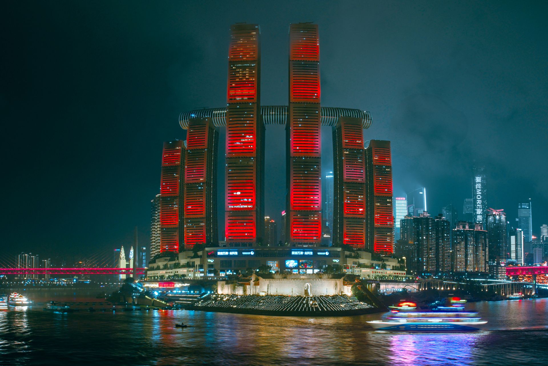 City skyline at night, representing cross-border reach